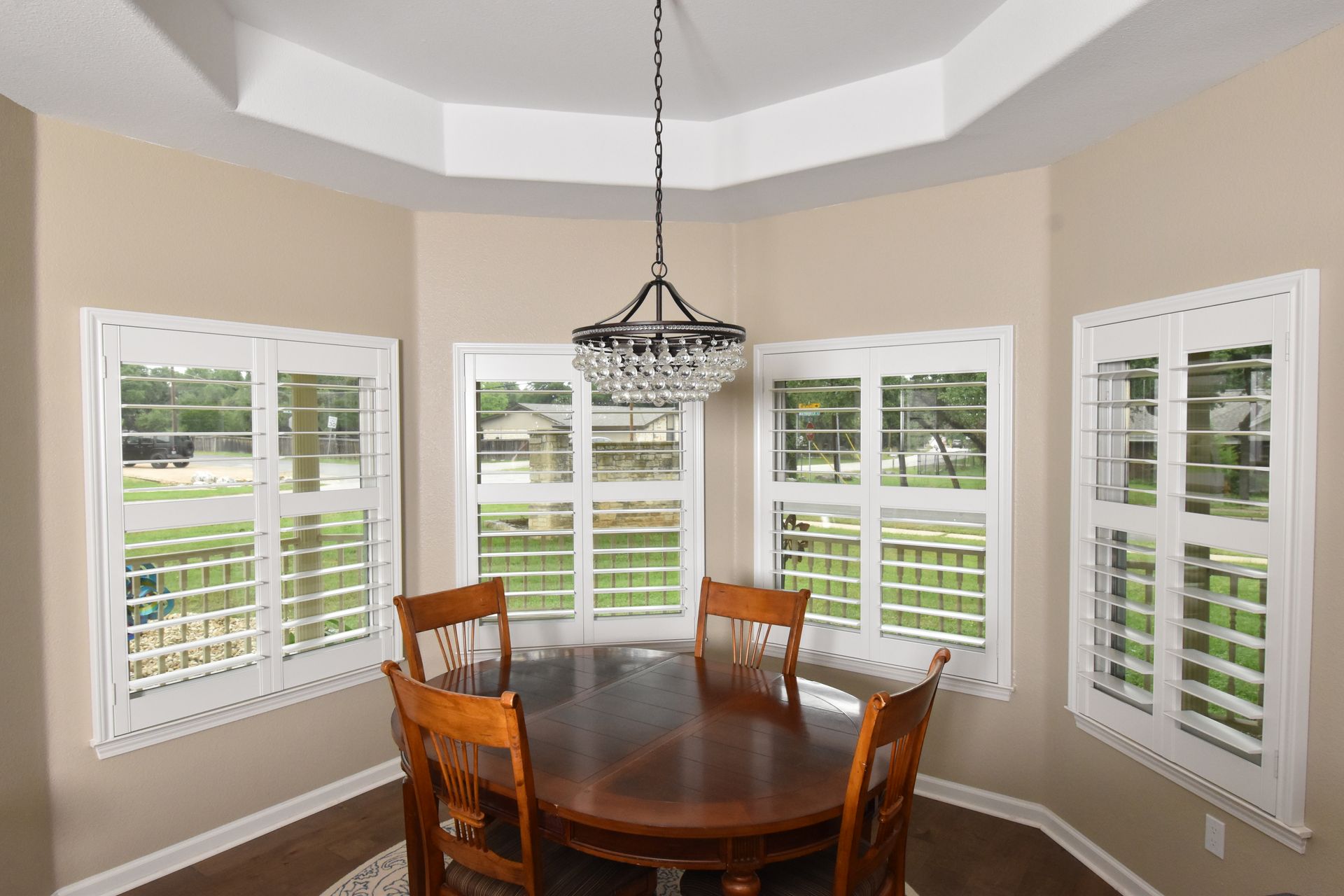 Bay window style white shutters in a Cedar Park, Texas dining room