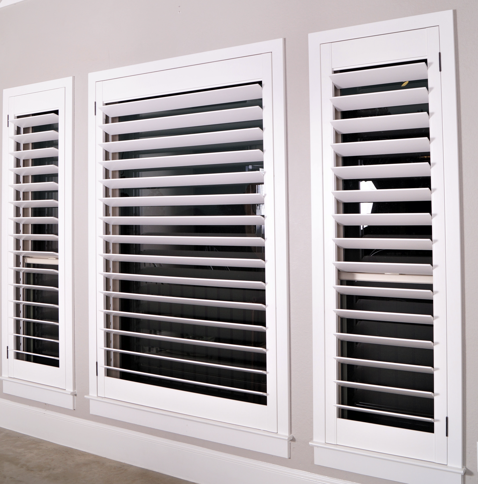 Traditional white plantation shutters in Central Austin home
