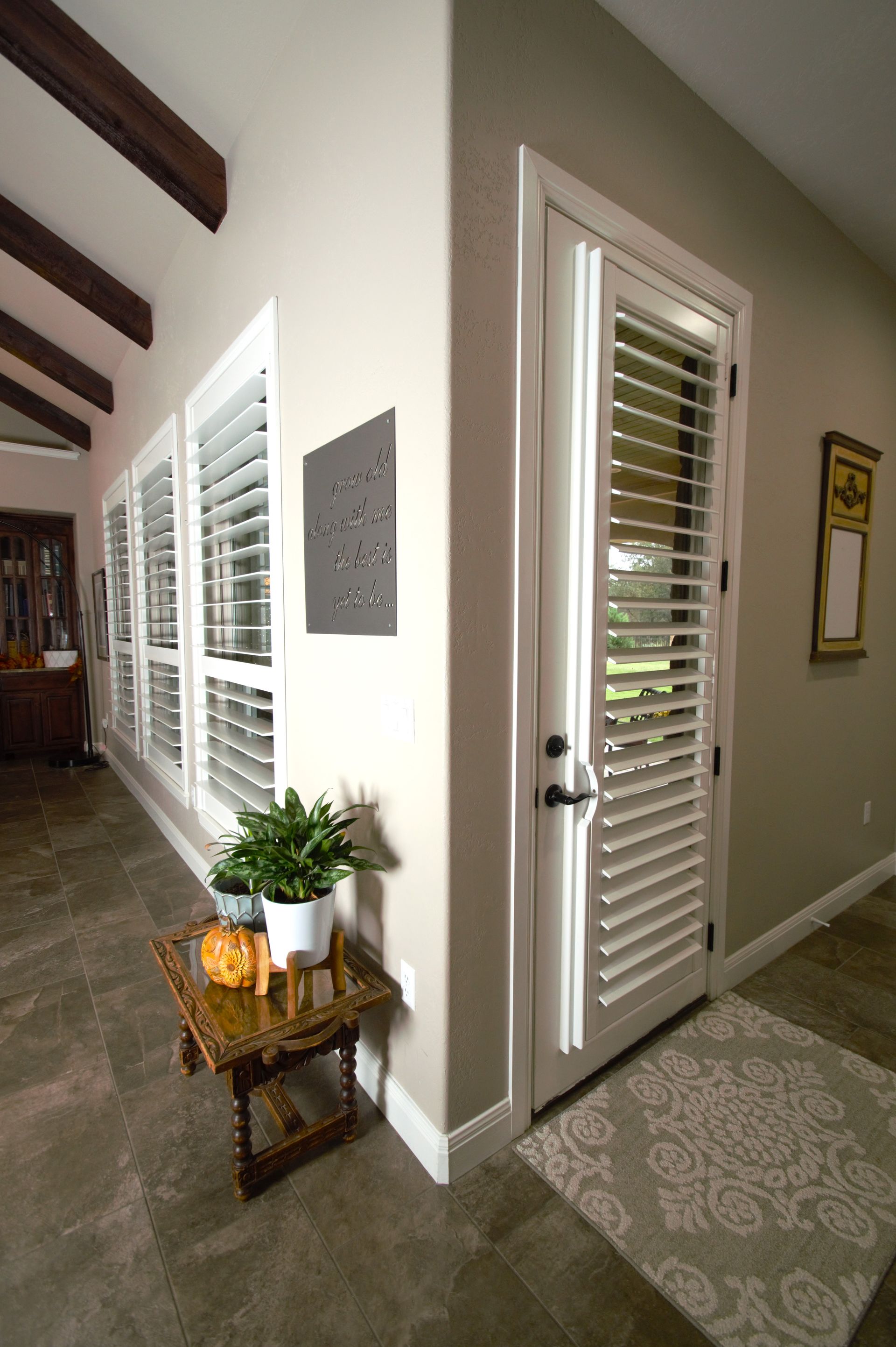 White plantation shutters covering interior door in Georgetown home