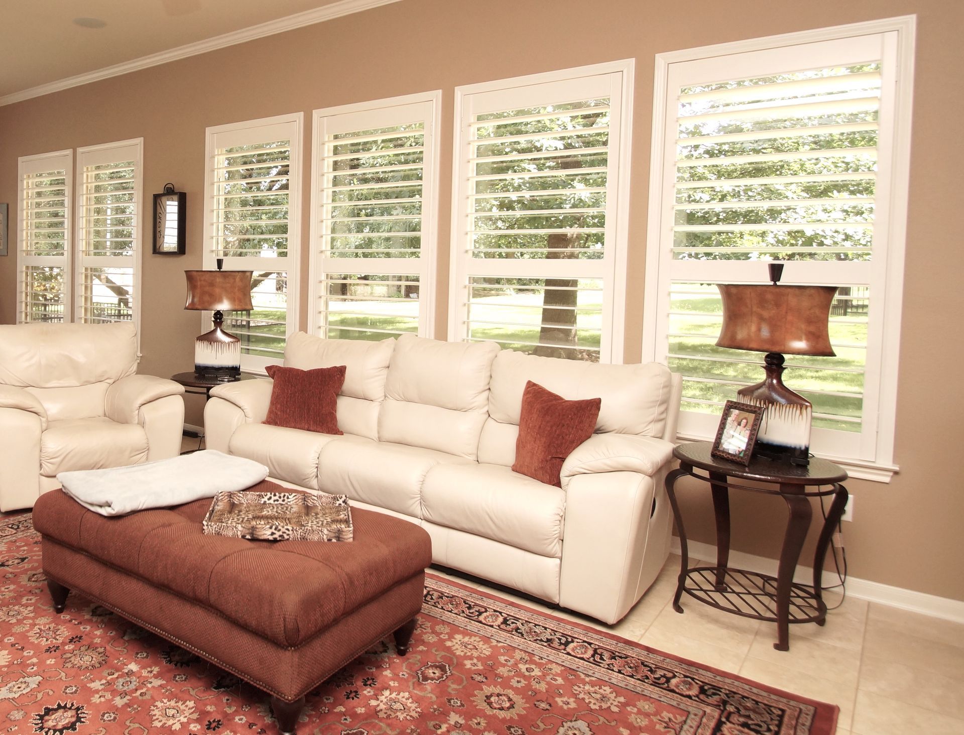 White window covering shutters in Georgetown, TX living room of home