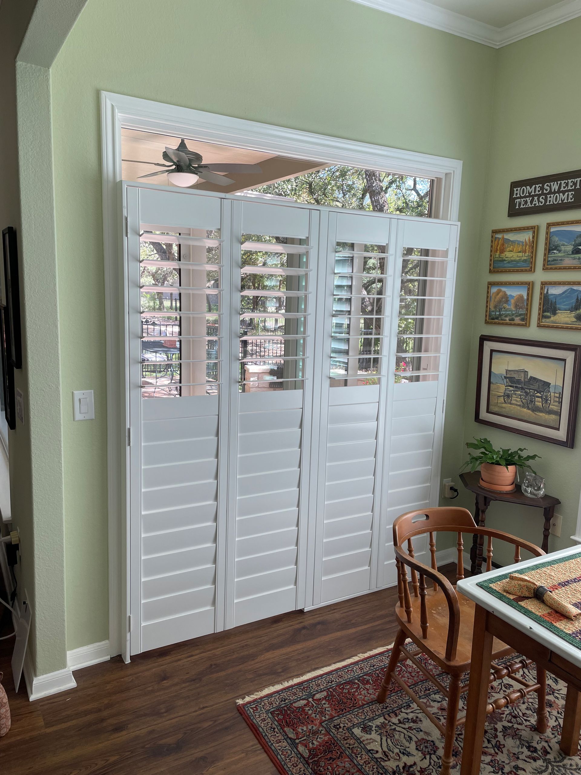 West lake hallway features arched plantation shutters over doors