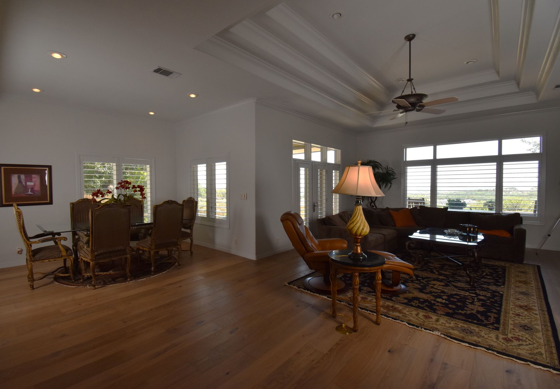 large window shutters in living room of Majestic Hills, TX home