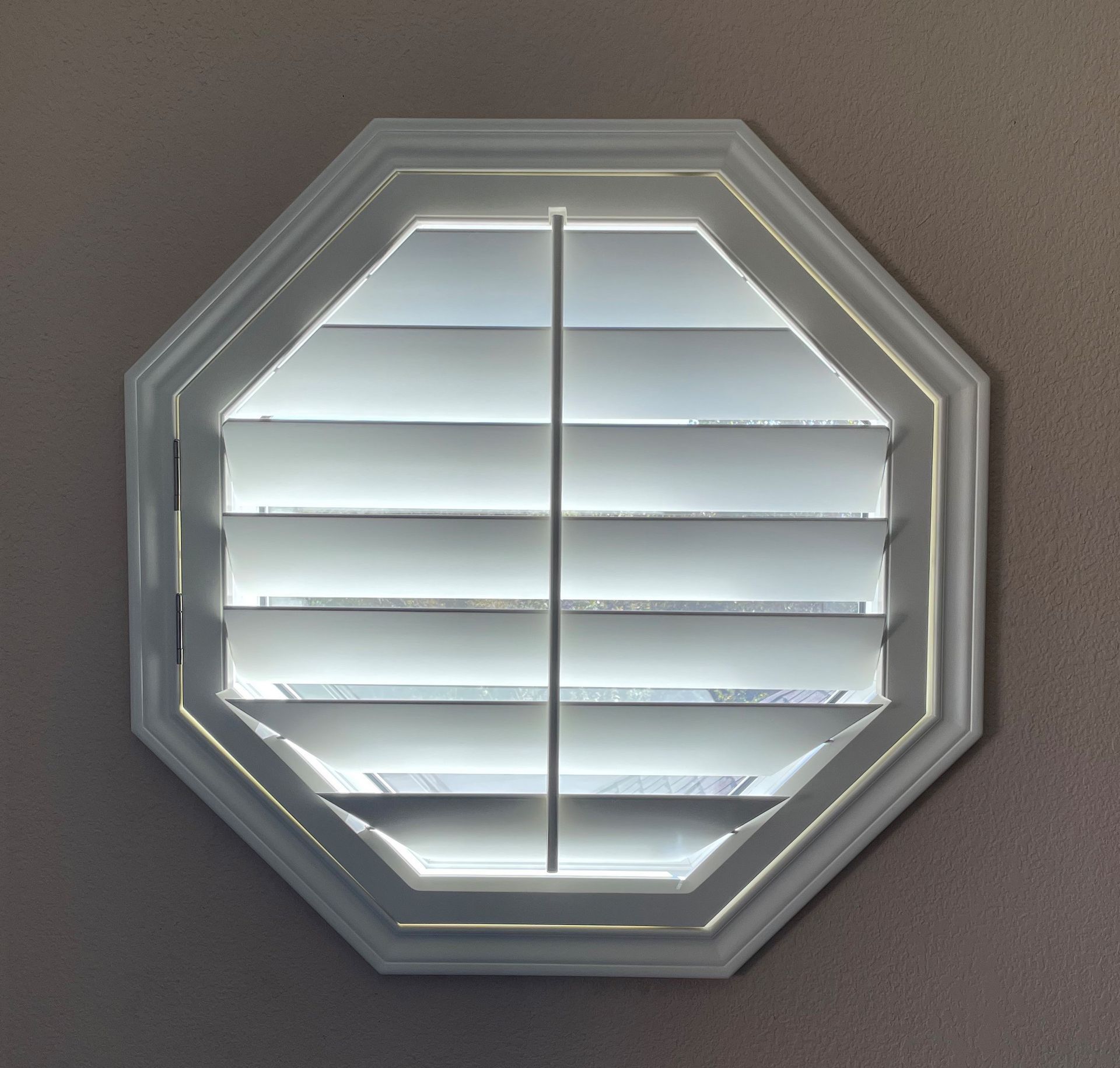 Octagon shaped plantation shutters in Cedar Park home