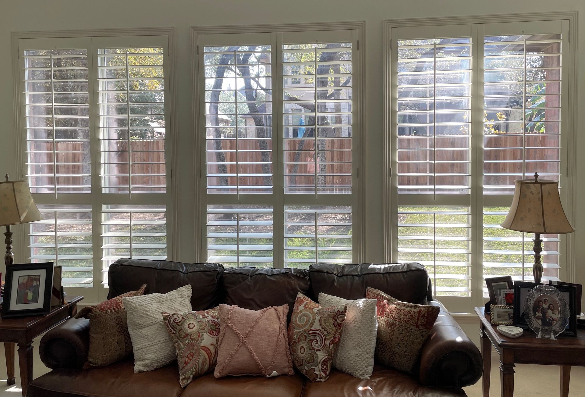 Interior white plantation shutters showing views to the outside
