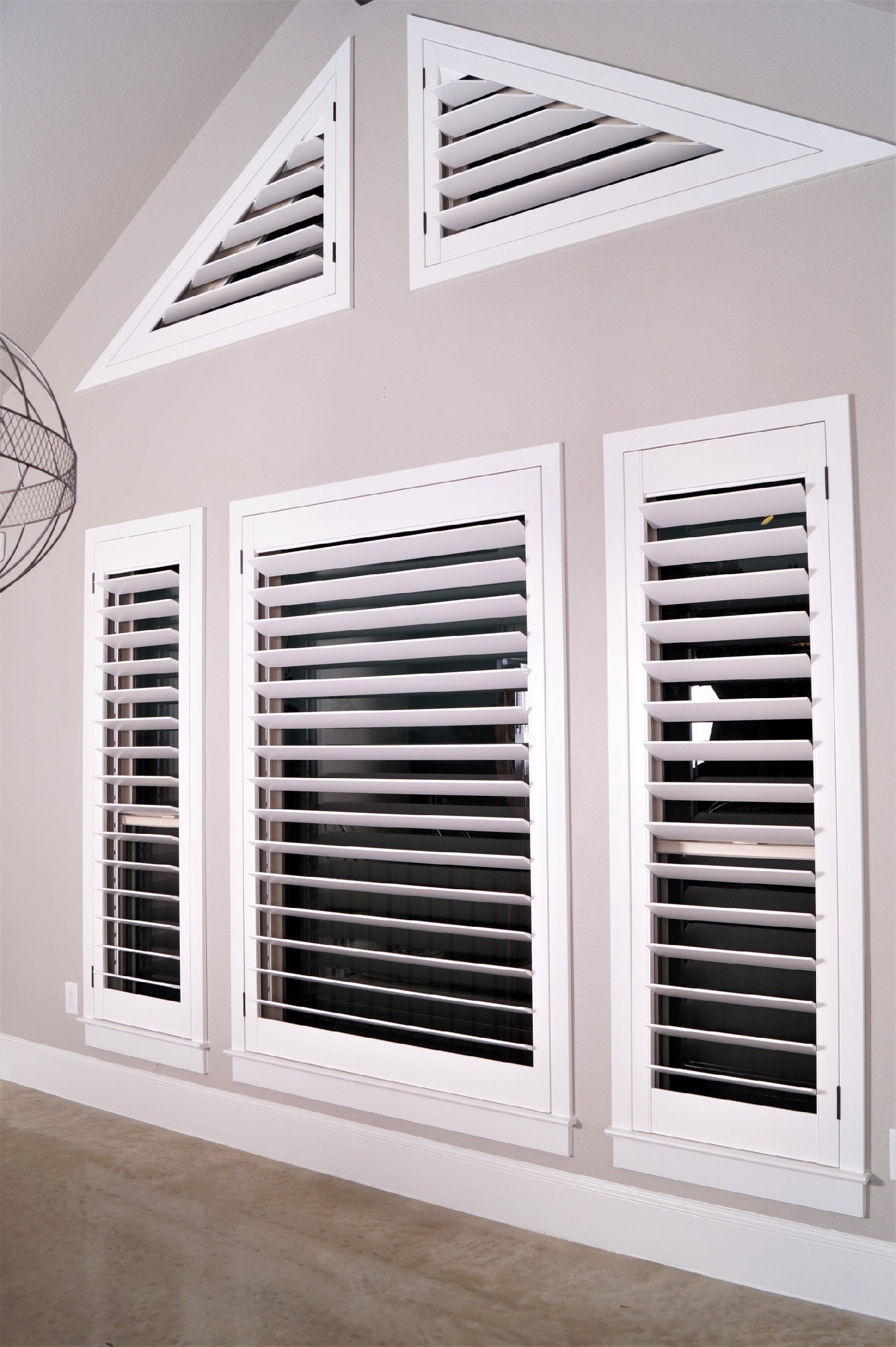 Triangle shaped interior white shutters