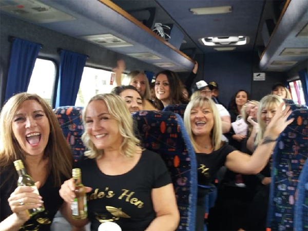 people enjoying themselves on a minibus