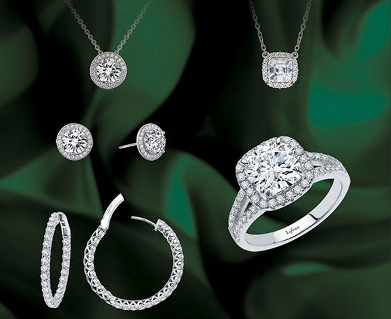 Silver diamond ring, necklaces, and earrings