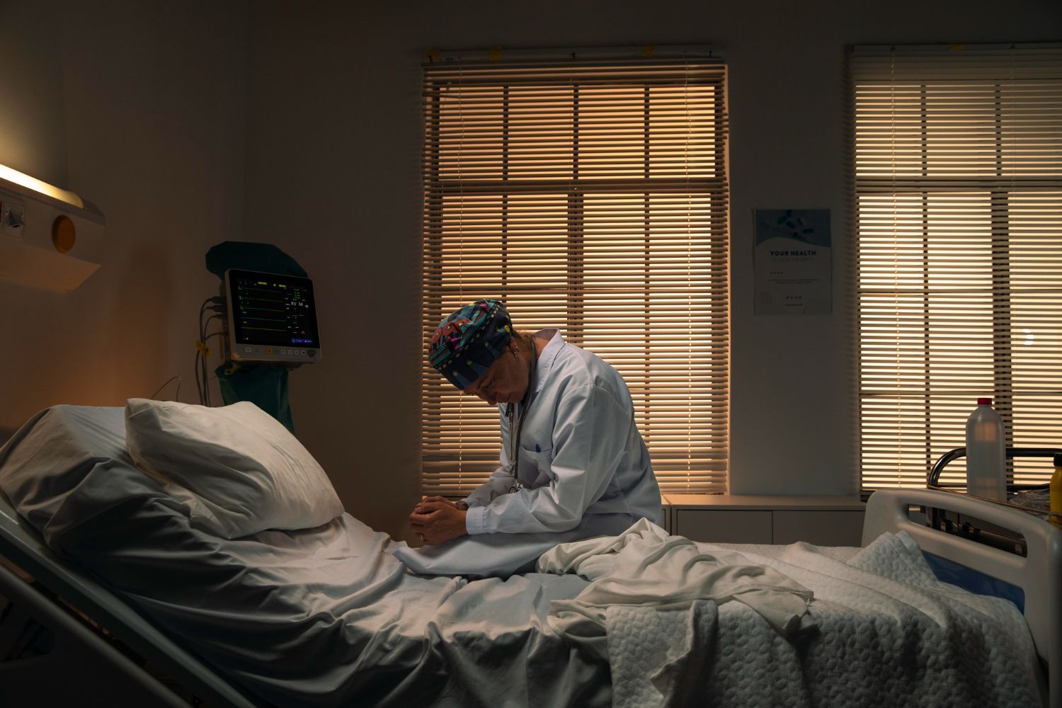 A man is sitting on a bicycle in front of a building.