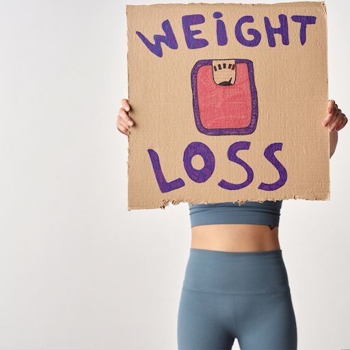 Woman holding a sign that says 