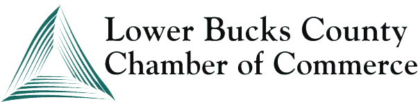 Logo of the Lower Bucks County Chamber of Commerce. Green triangle with radiating lines and text below.