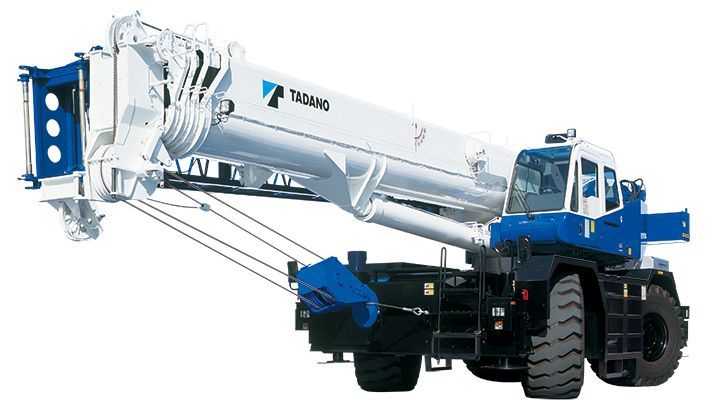 A large yellow crane is parked in a parking lot