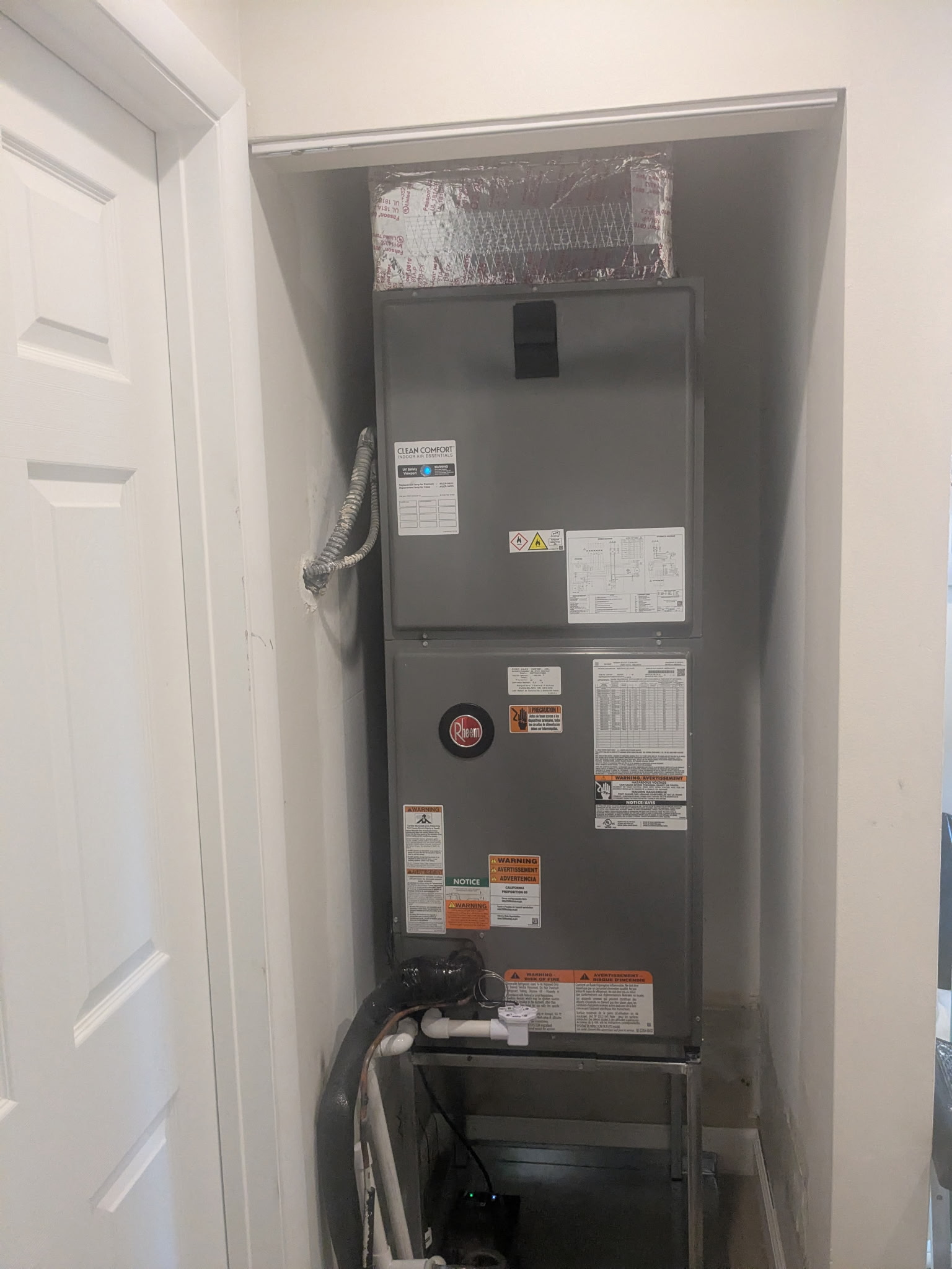 HVAC unit in a recessed alcove, with a door to the left.