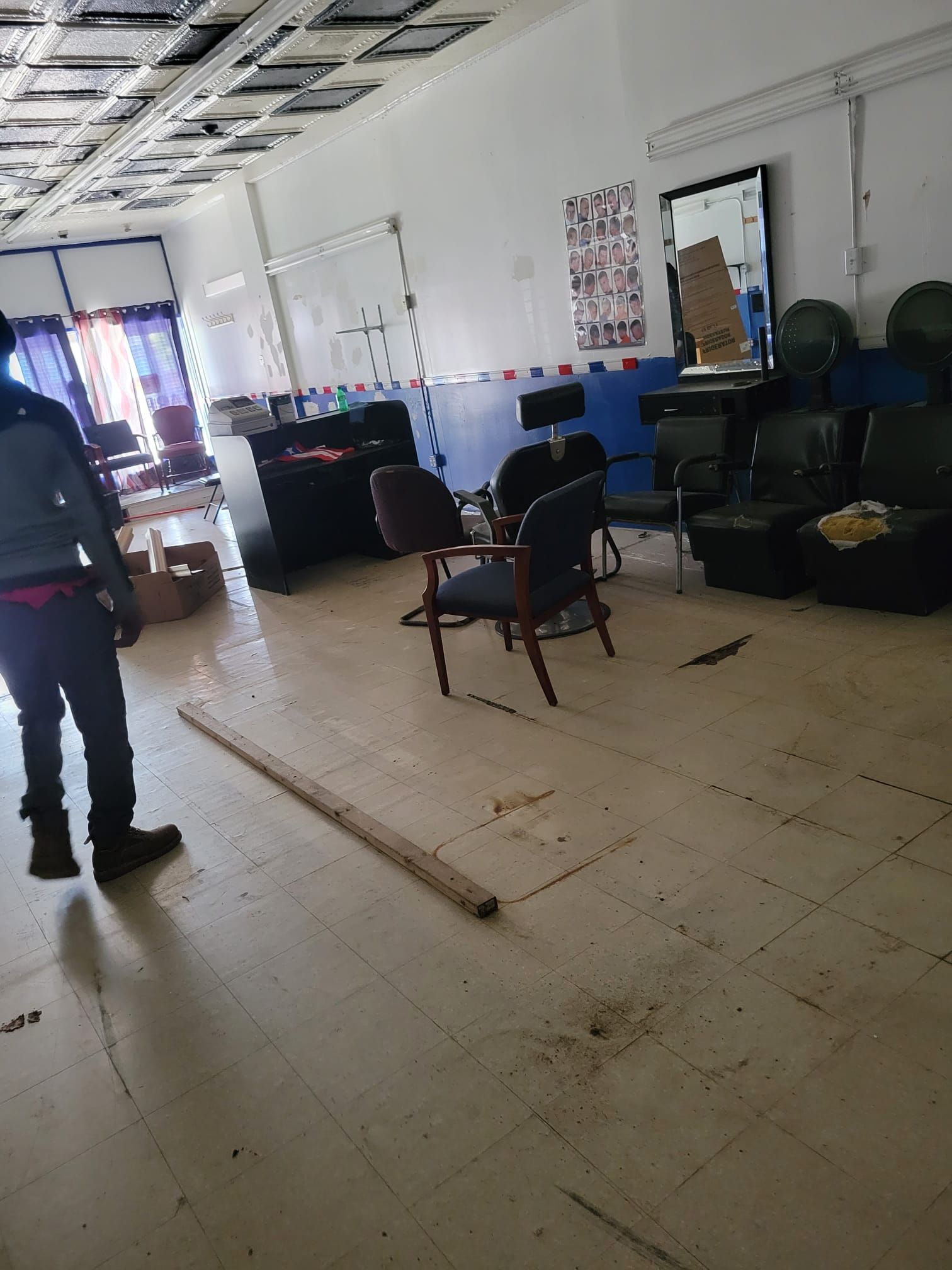 Man Walking In Room With Desk And Chairs - Hartford, CT - Hinds
