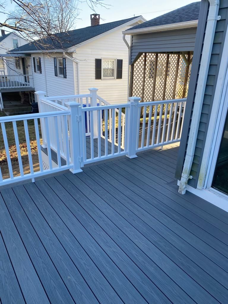 Deck with white fence and clean gray flooring – Hartford, CT - Hinds