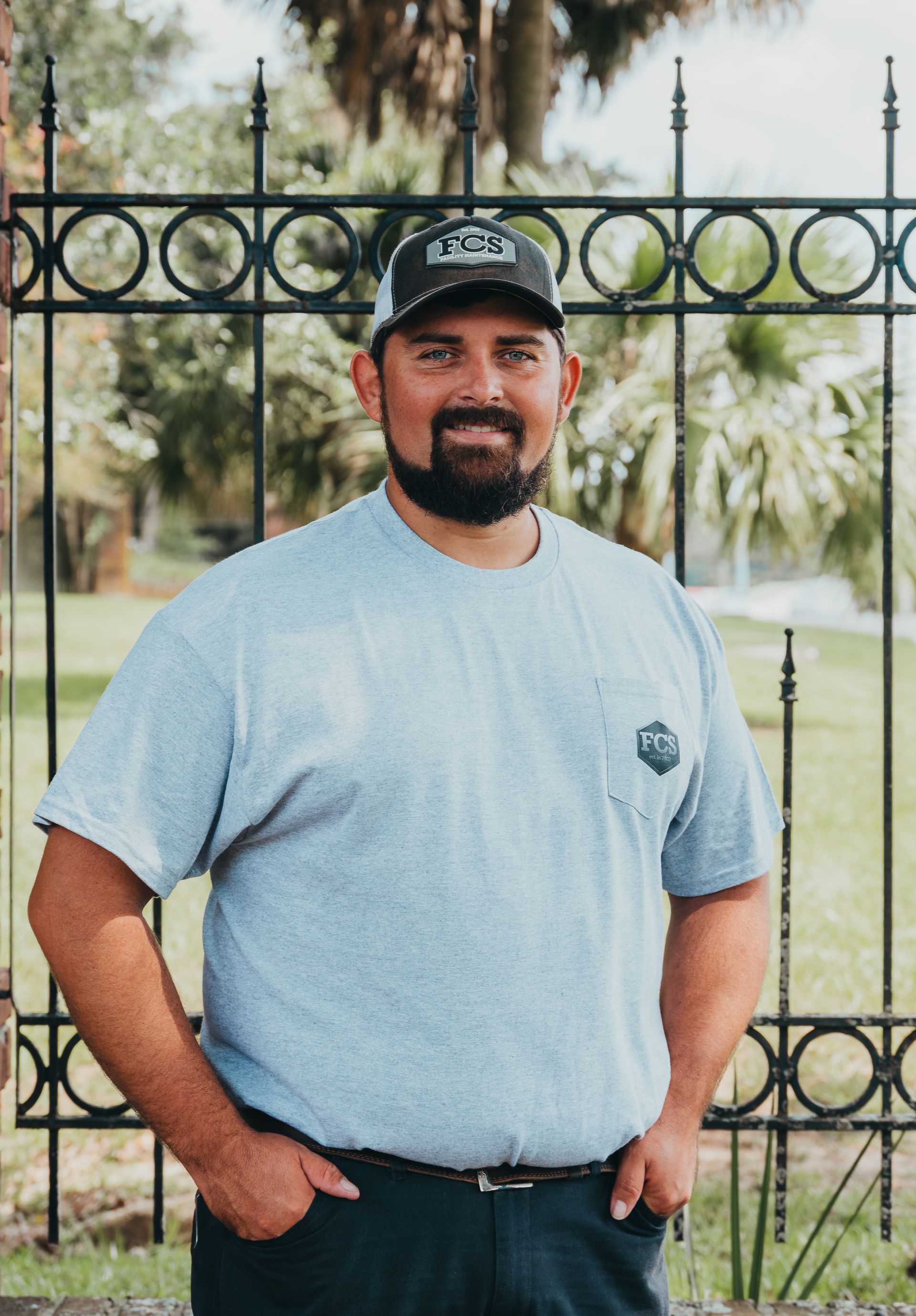 A silhouette of a person without a face on a gray background.