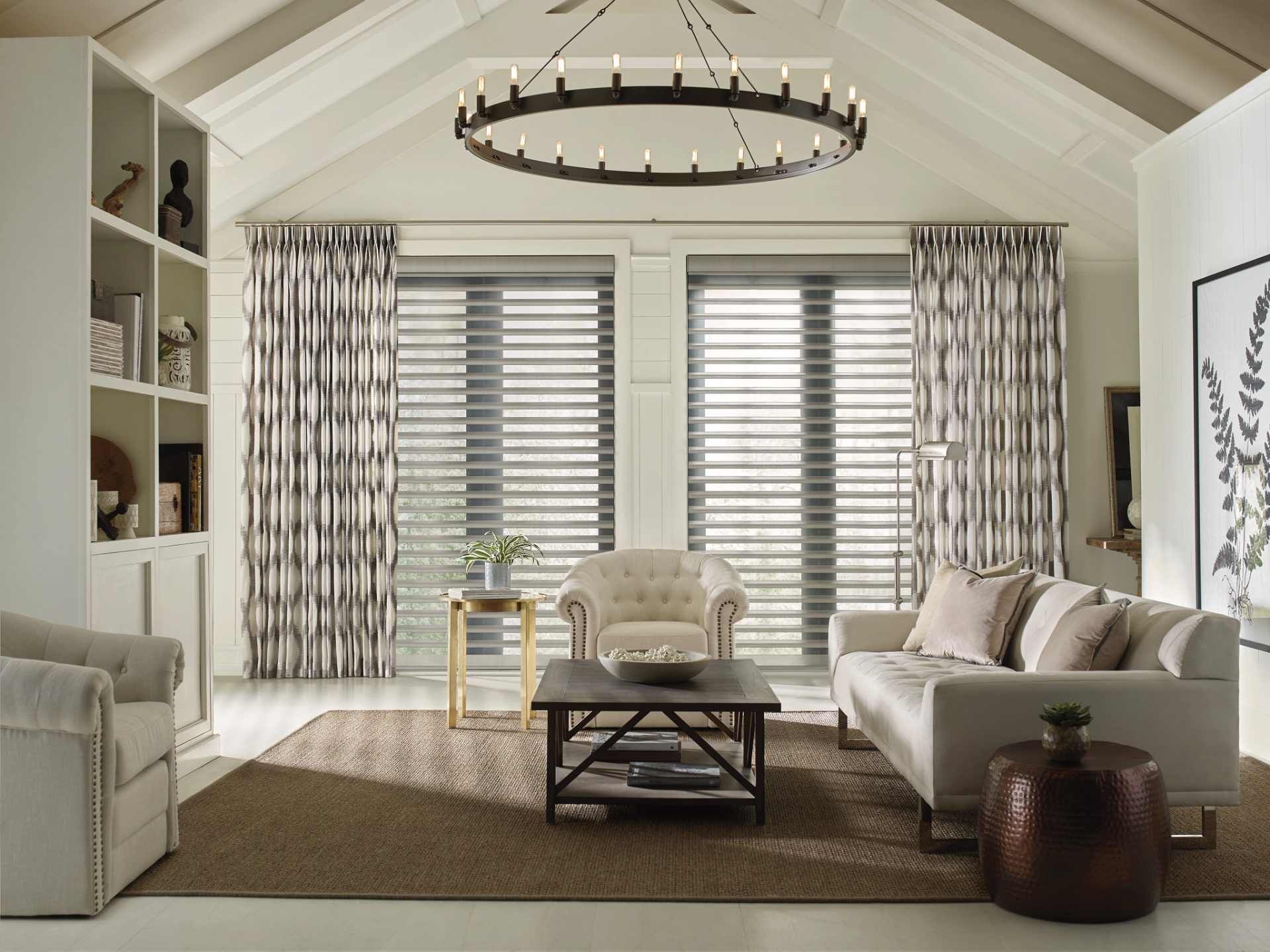 Window shutters installed in a home, flanked on either side by flowing drapes near Glendora, Califor