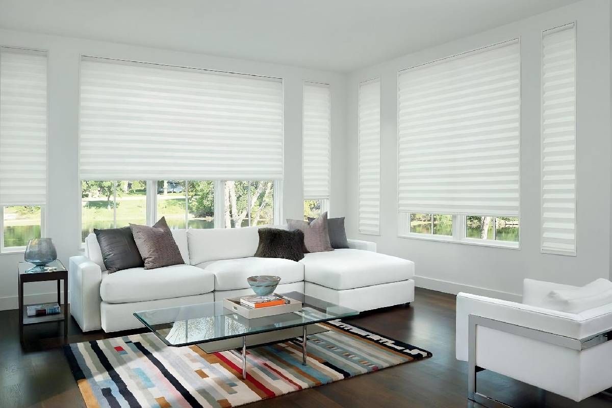 Beautifully designed living room with clean, white shades decorating the windows near Glendora, California (CA)