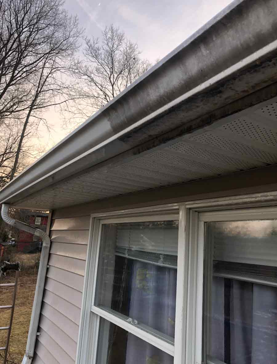 Stain in Roof Gutter — Pressure Cleaning Services in Englewood, NJ