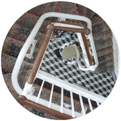 Image showing a curved stairlift rail installed by Alfix Stairlifts