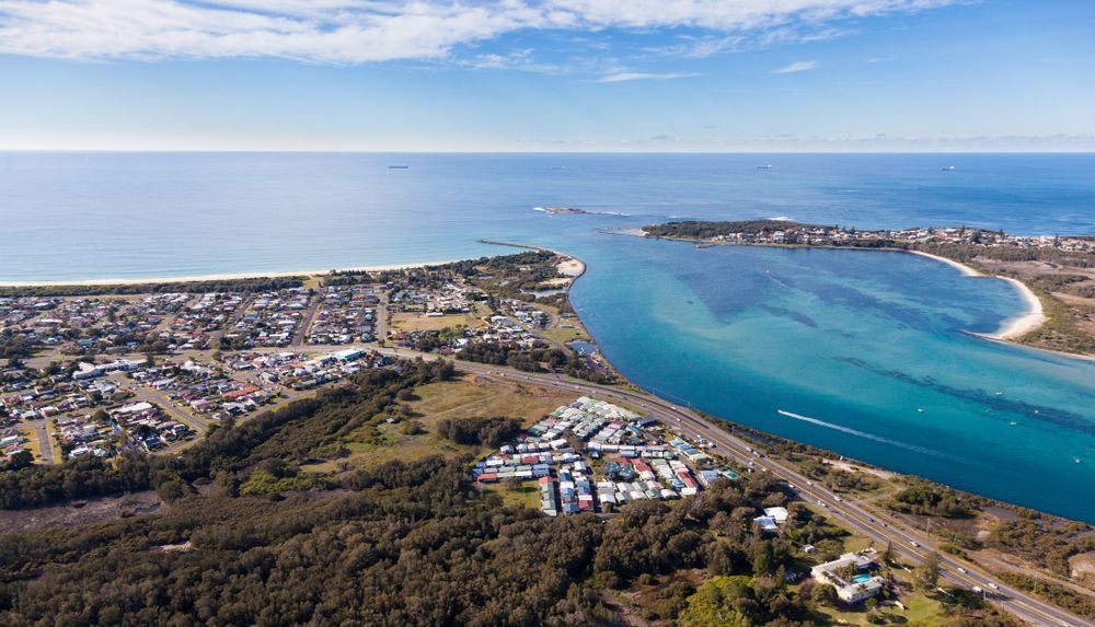 Aerial View of a Coastal Town With a River Flowing Into the Ocean — Lake Macquarie Mobile Locksmiths in Blacksmiths, NSW