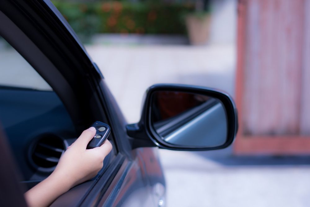 Hand Holding a Car Remote