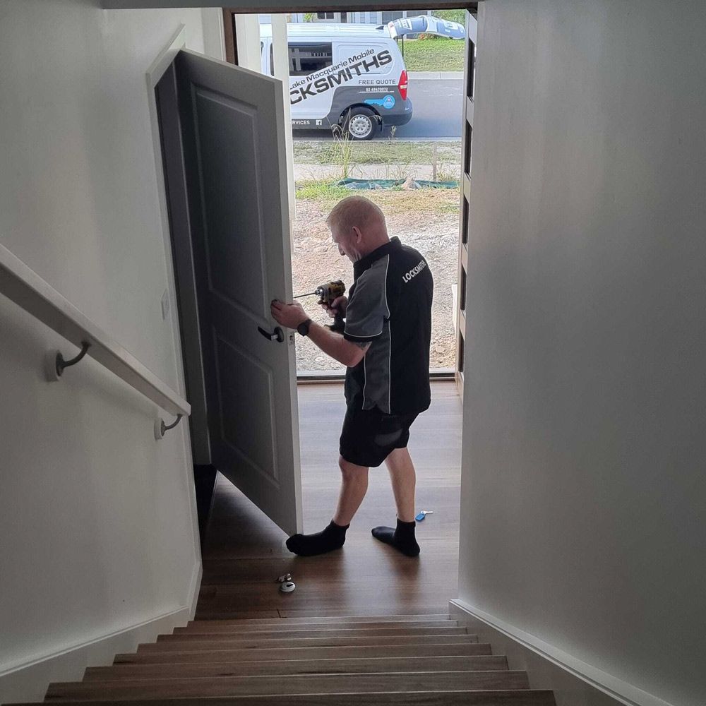 Locksmith Fixing Door Lock of A Residential House