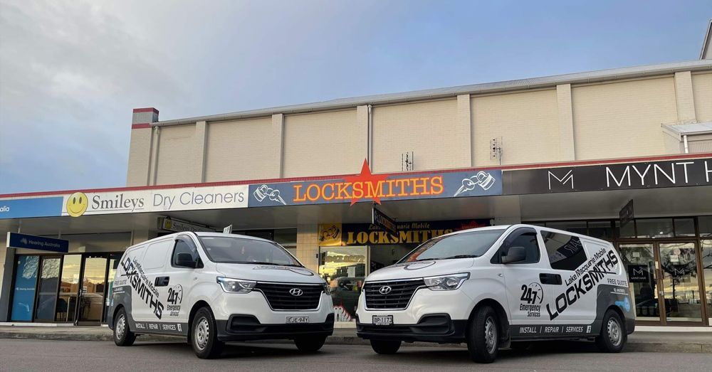 Two Cars Outside a Locksmith Shop