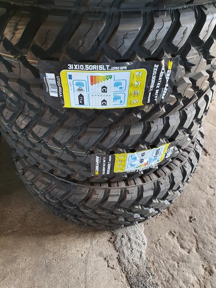 Two Tires Are Stacked On Top Of Each Other On The Ground — Johnny Farming Company In Ooralea, QLD