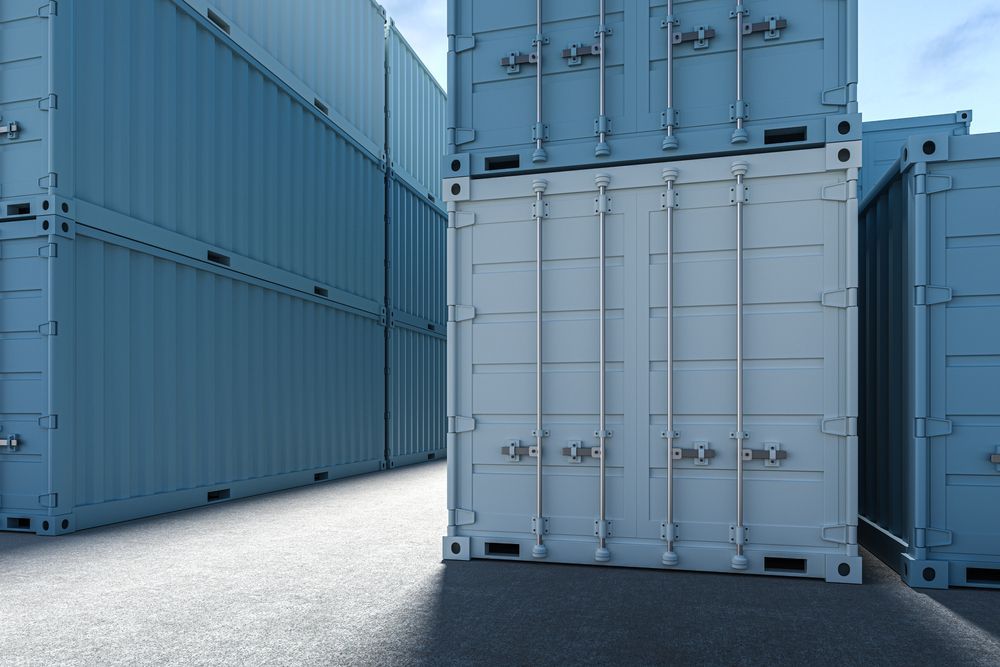 Blue Shipping Containers Stacked on a Paved Surface — Johnny Farming Company In Ooralea, QLD