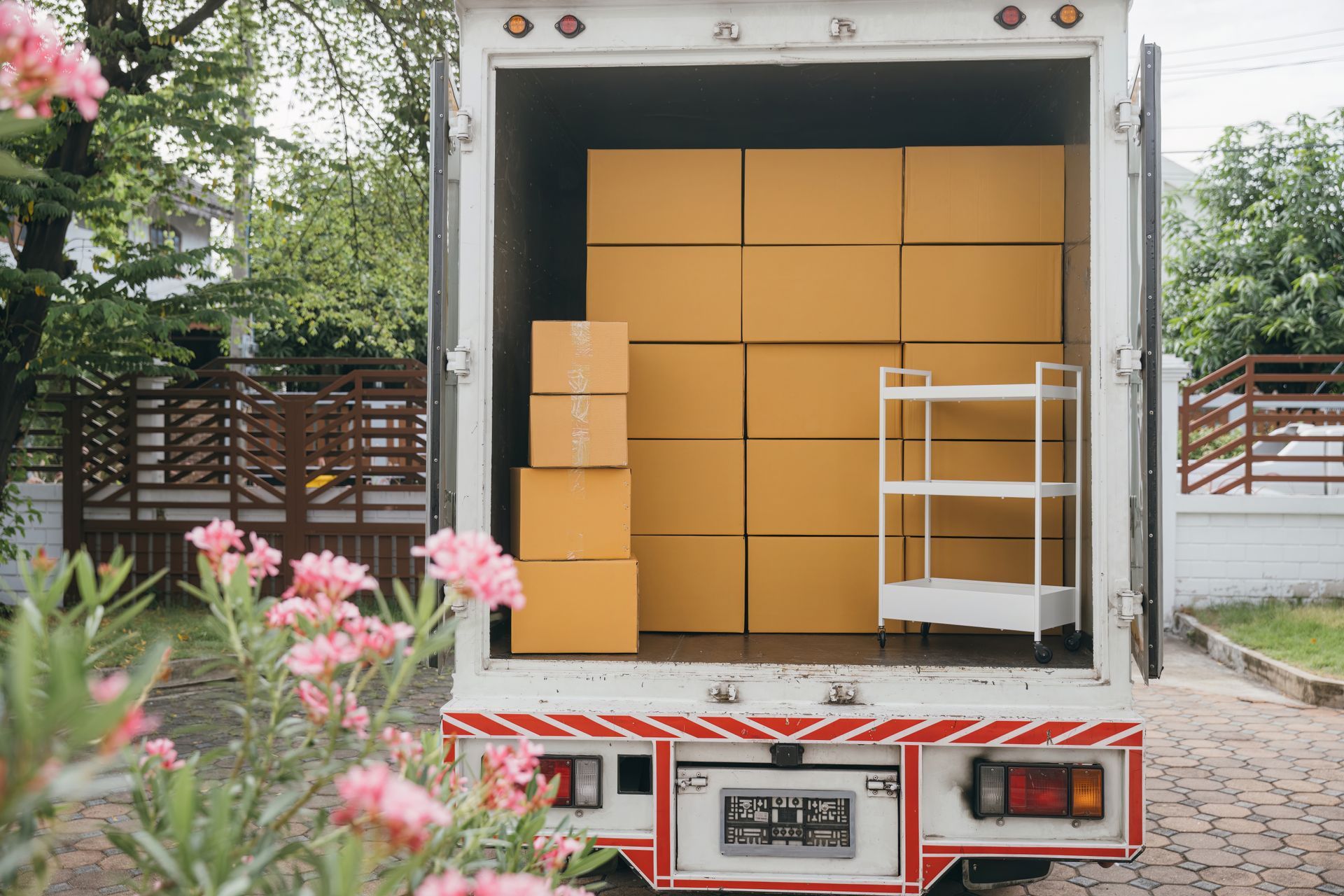 Truck Bed Loaded With Cardboard Boxes and a White Shelving Unit, Parked Outside — Johnny Farming Company In Ooralea, QLD