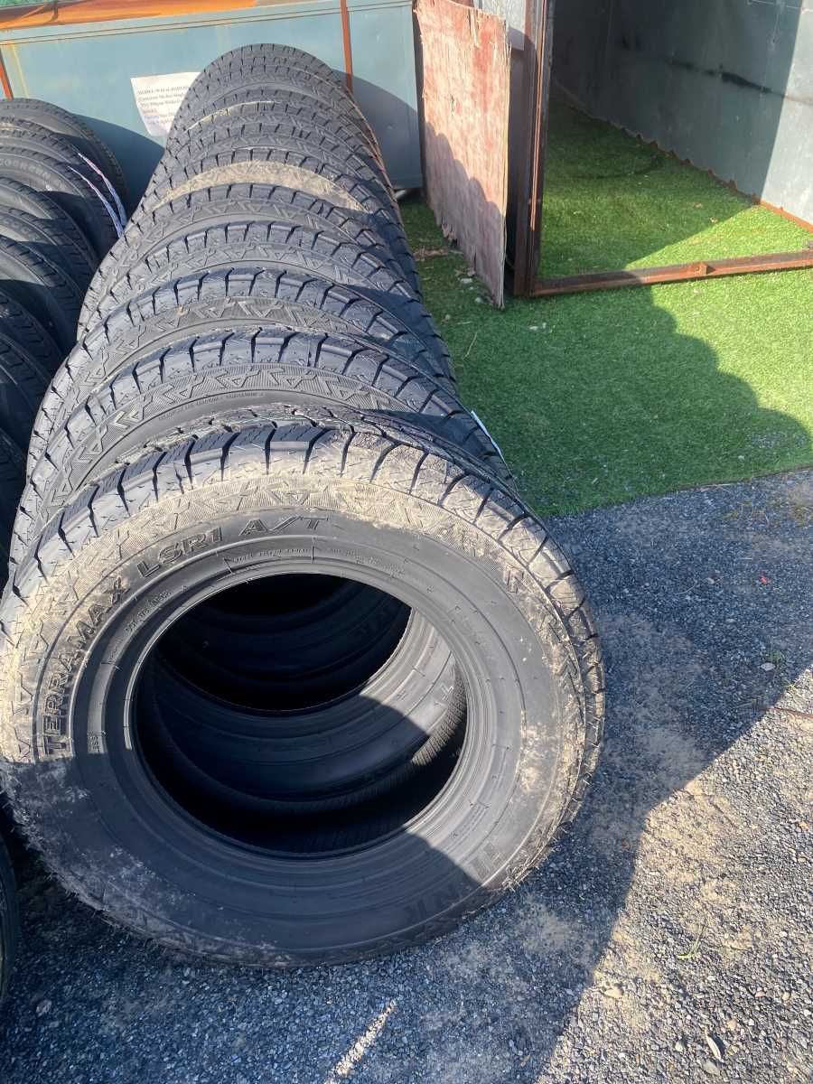A Bunch Of Tires Are Stacked On Top Of Each Other On The Ground — Johnny Farming Company In Ooralea, QLD