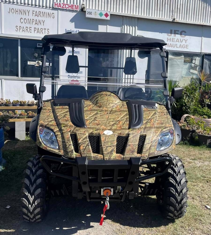 An Atv Is Parked In Front Of A Building That Says Johnny Farming Company Spare Parts — Johnny Farming Company In Ooralea, QLD