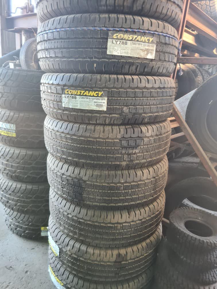 A Pile Of Tires Stacked On Top Of Each Other In A Garage — Johnny Farming Company In Ooralea, QLD
