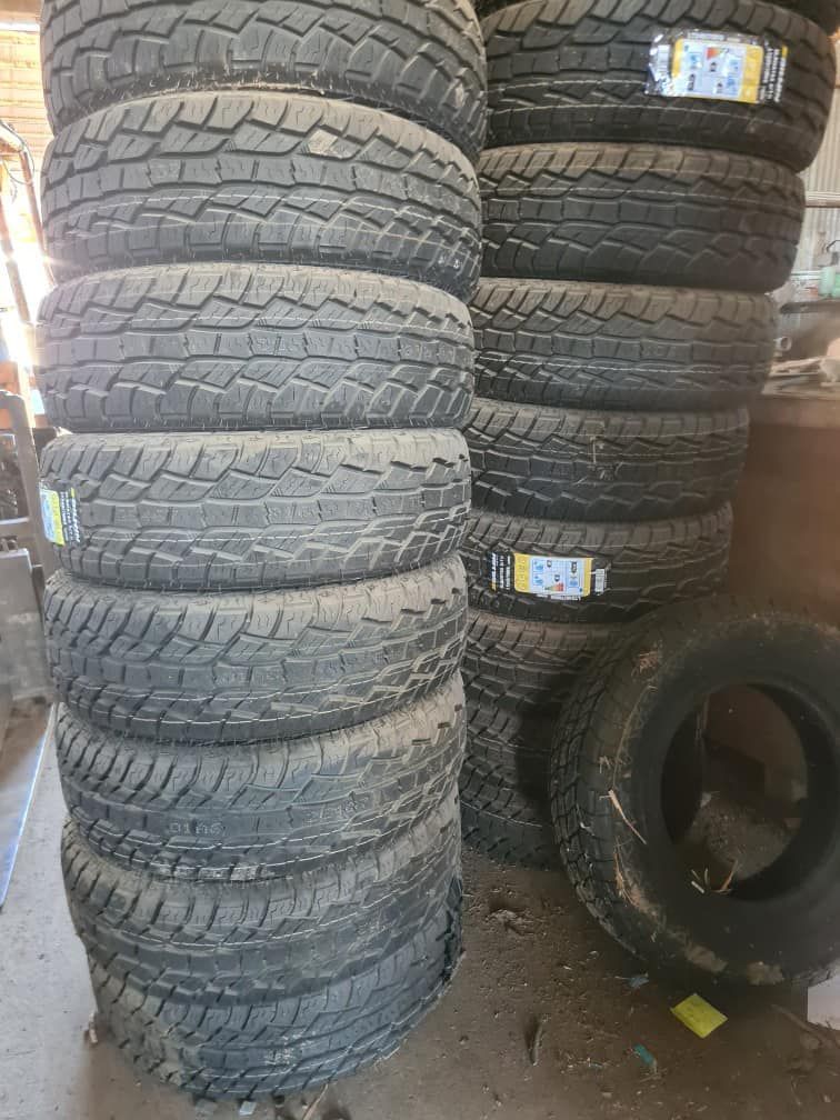 A Pile Of Tires Stacked On Top Of Each Other In A Garage — Johnny Farming Company In Ooralea, QLD