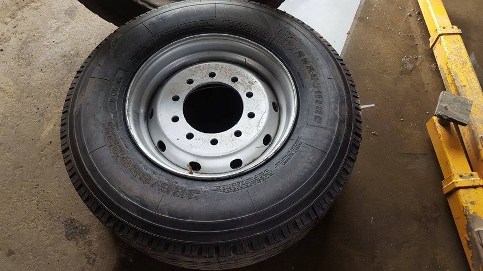 A Close Up Of A Tire And Rim On A Concrete Floor — Johnny Farming Company In Ooralea, QLD