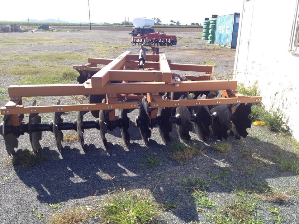 A Tractor Is Parked On The Side Of The Road — Johnny Farming Company In Ooralea, QLD