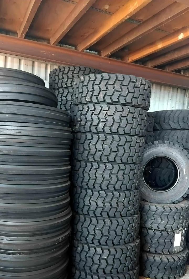 A Bunch Of Tires Are Stacked On Top Of Each Other On The Ground — Johnny Farming Company In Ooralea, QLD