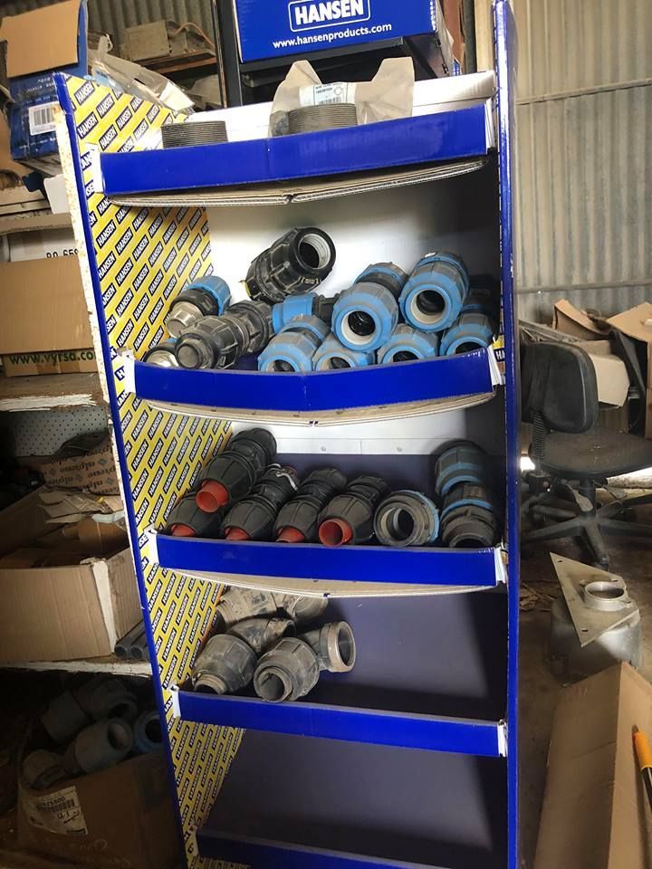 A Shelf Filled With Various Types Of Pipes And Fittings — Johnny Farming Company In Ooralea, QLD