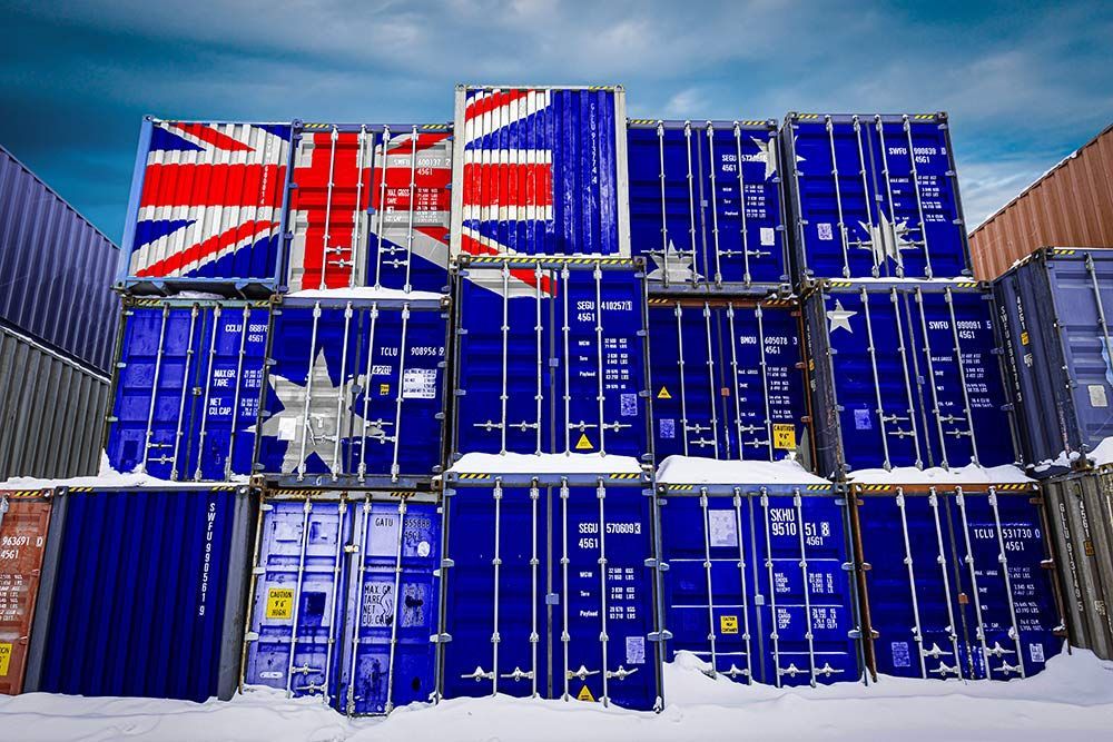 A Stack of Shipping Containers With Flags Painted on Them — Johnny Farming Company In Ooralea, QLD