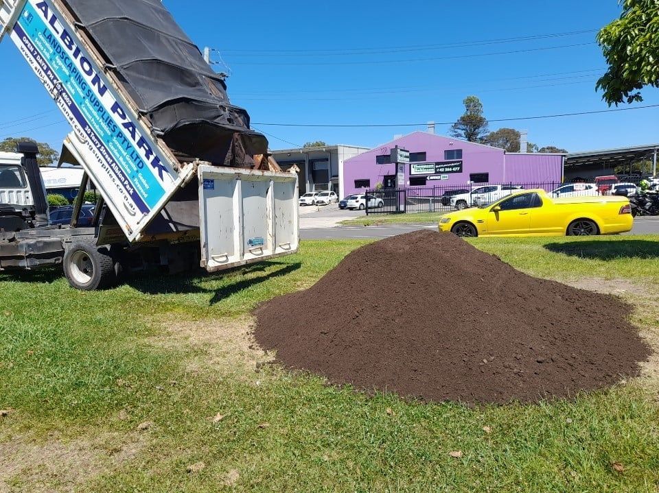 Excavator Loading Gravel — Landscaping Materials In Albion Park, NSW
