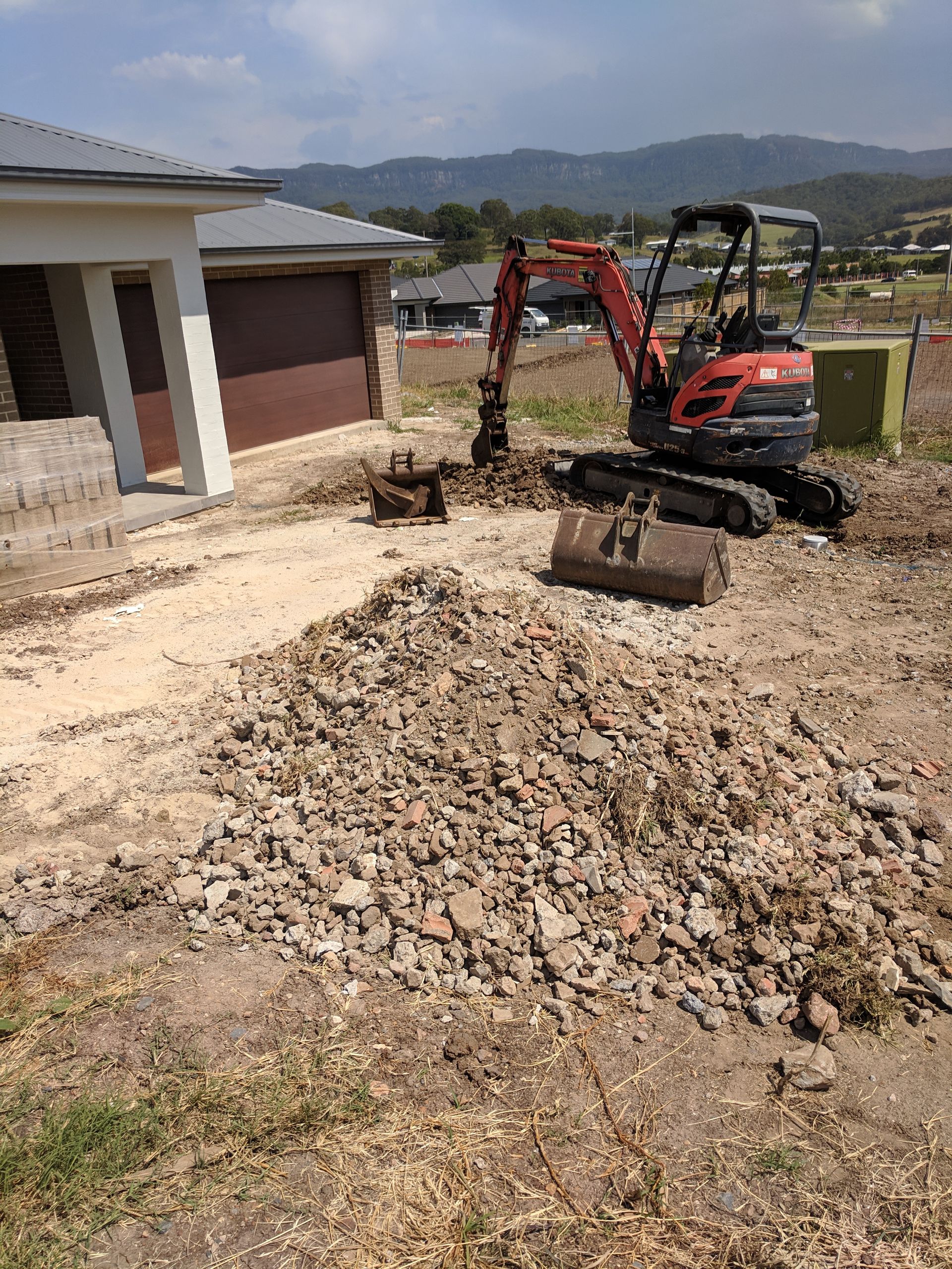 Red Mini Excavator At Residential Construction Yard – Excavation Hire In Albion Park