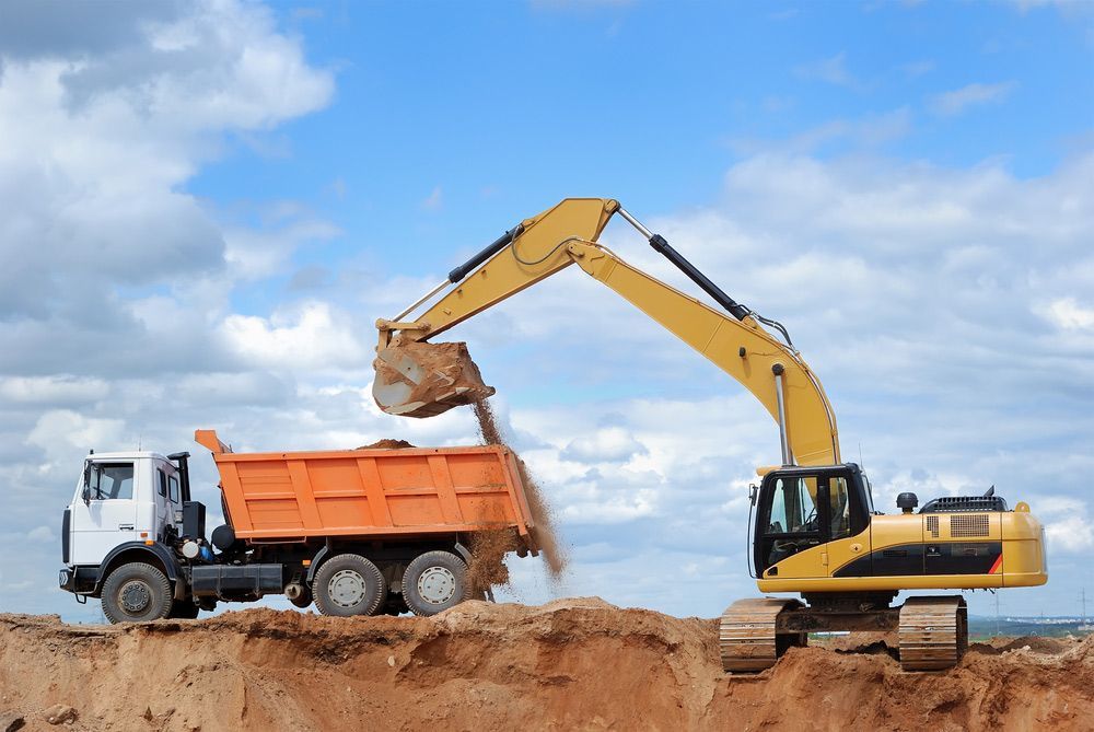 Excavator Loading Sand In Rear-End Tipper — Landscaping Materials In Robertson, NSW