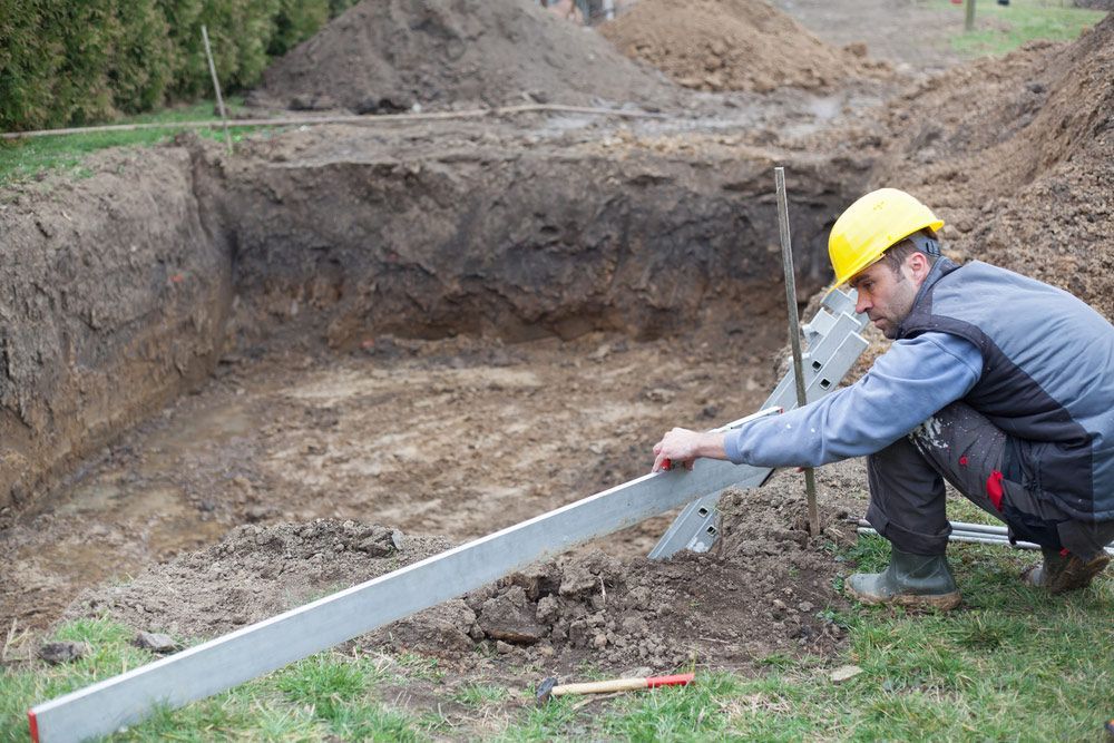 Man Working On Building A Private Pool — Landscaping Materials In Shellharbour, NSW