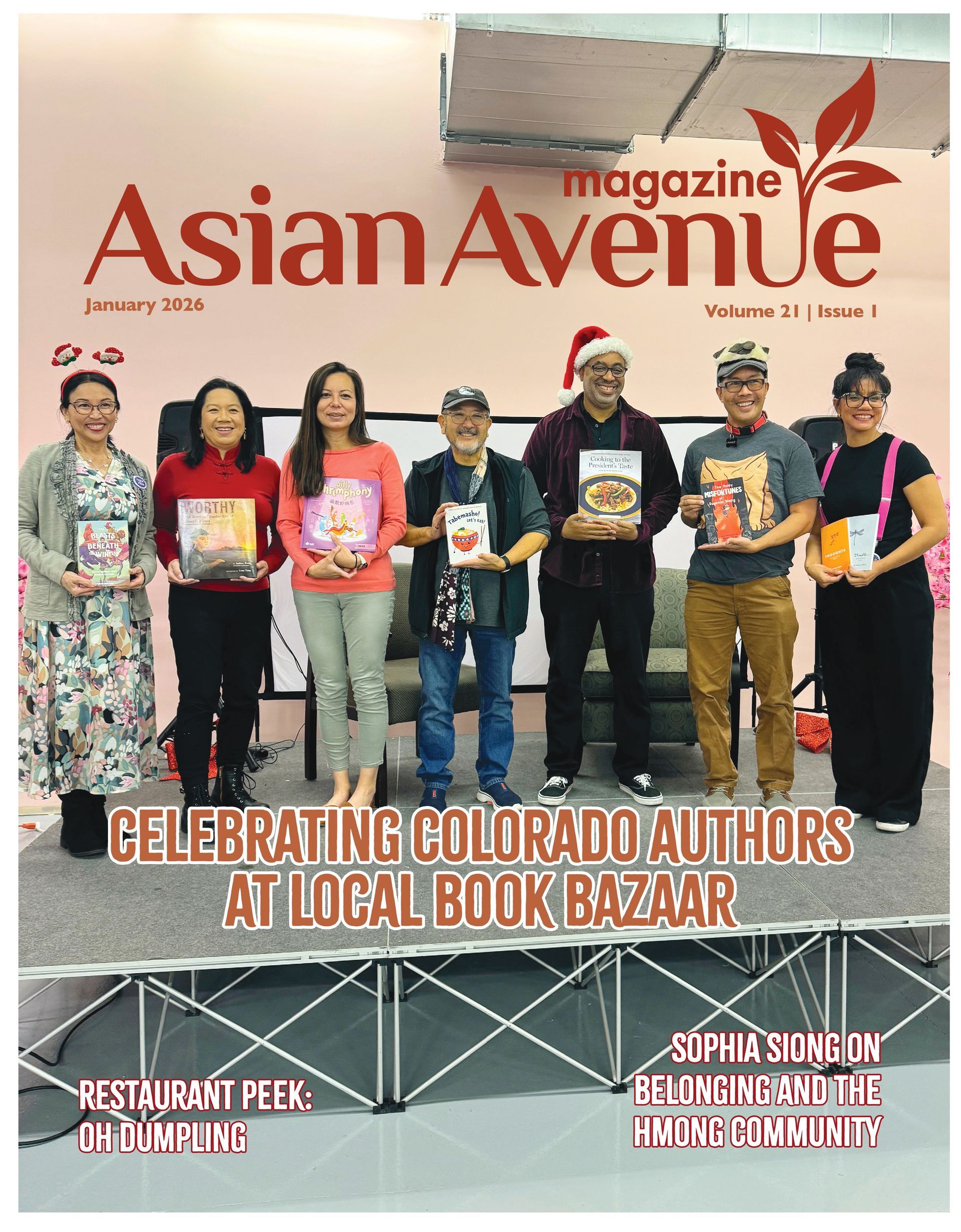 Cover of Asian Avenue Magazine featuring authors at a book bazaar, celebrating Colorado authors.