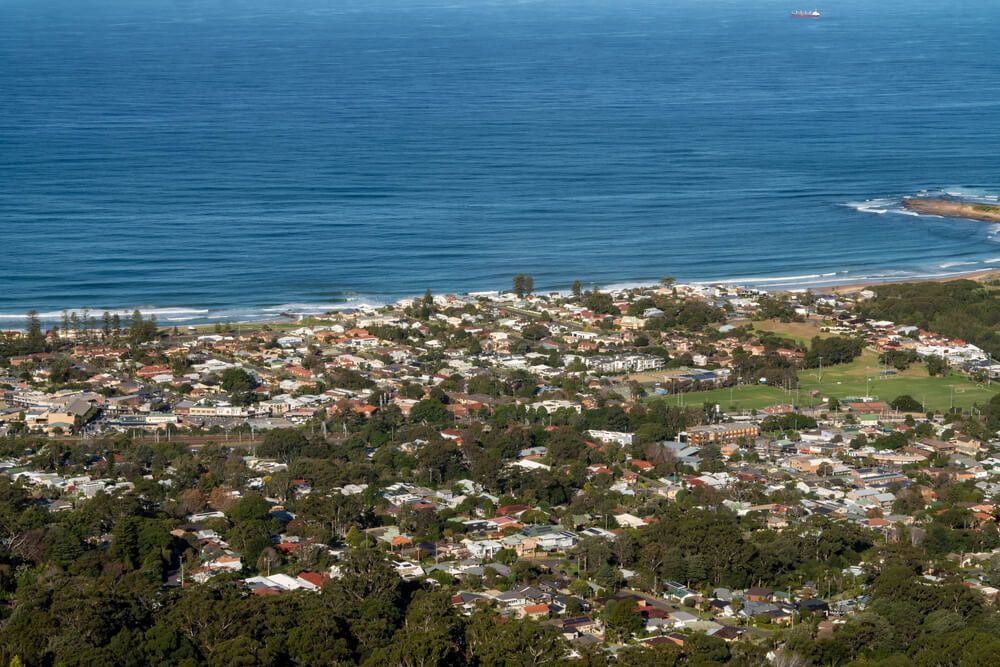 An Aerial View of A City Next to The Ocean — Tradewind Building Maintenance in Austinmer,NSW