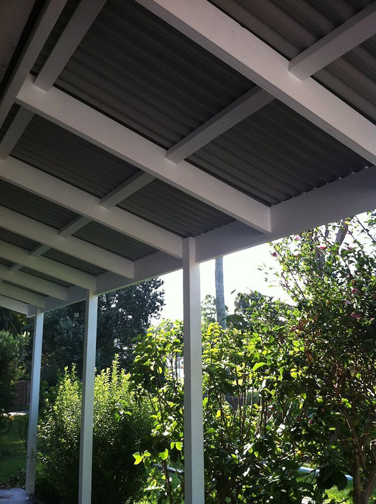 A Covered Area with Trees and Bushes in The Background — Tradewind Building Maintenance in Wollongong,NSW