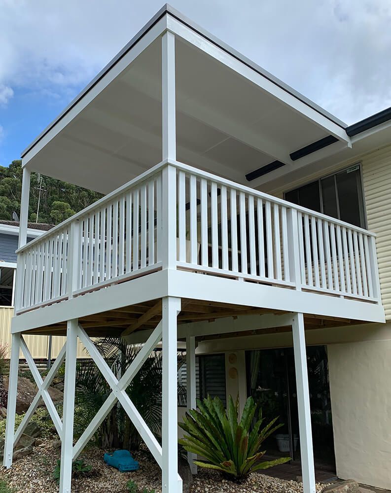 A White Deck with A Canopy Is Build  on Top of A House — Tradewind Building Maintenance in Woonona,NSW
