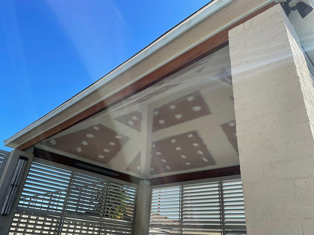 Looking up At the Ceiling of A Building with A Blue Sky in The Background — Tradewind Building Maintenance in Bulli,NSW