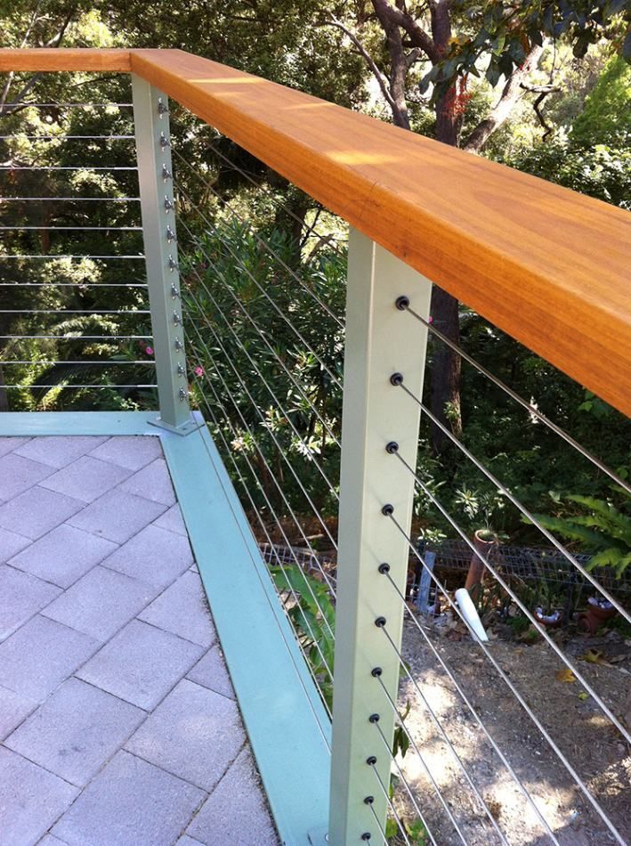 A Balcony with A Wooden Railing and Wire Fence — Tradewind Building Maintenance in Austinmer,NSW