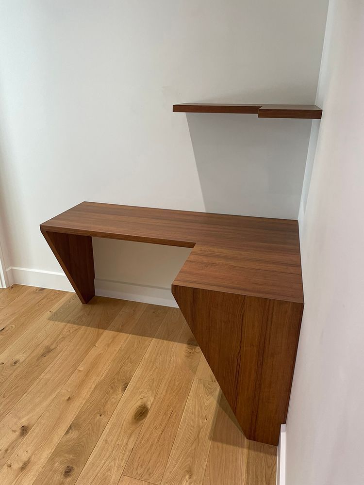 A Wooden Desk with A Shelf Above It in A Room with Hardwood Floors — Tradewind Building Maintenance in Austinmer,NSW
